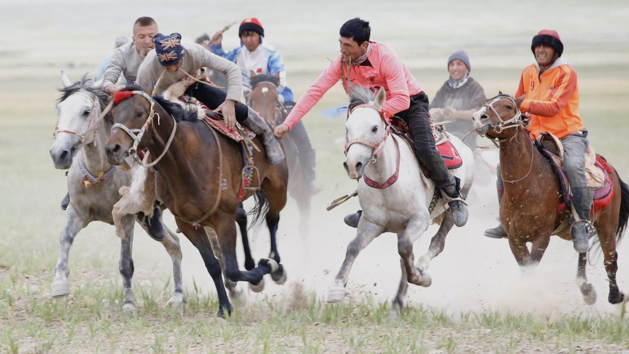 Youths of Tajik ethnic group play 'goat pulling' sport in Xinjiang