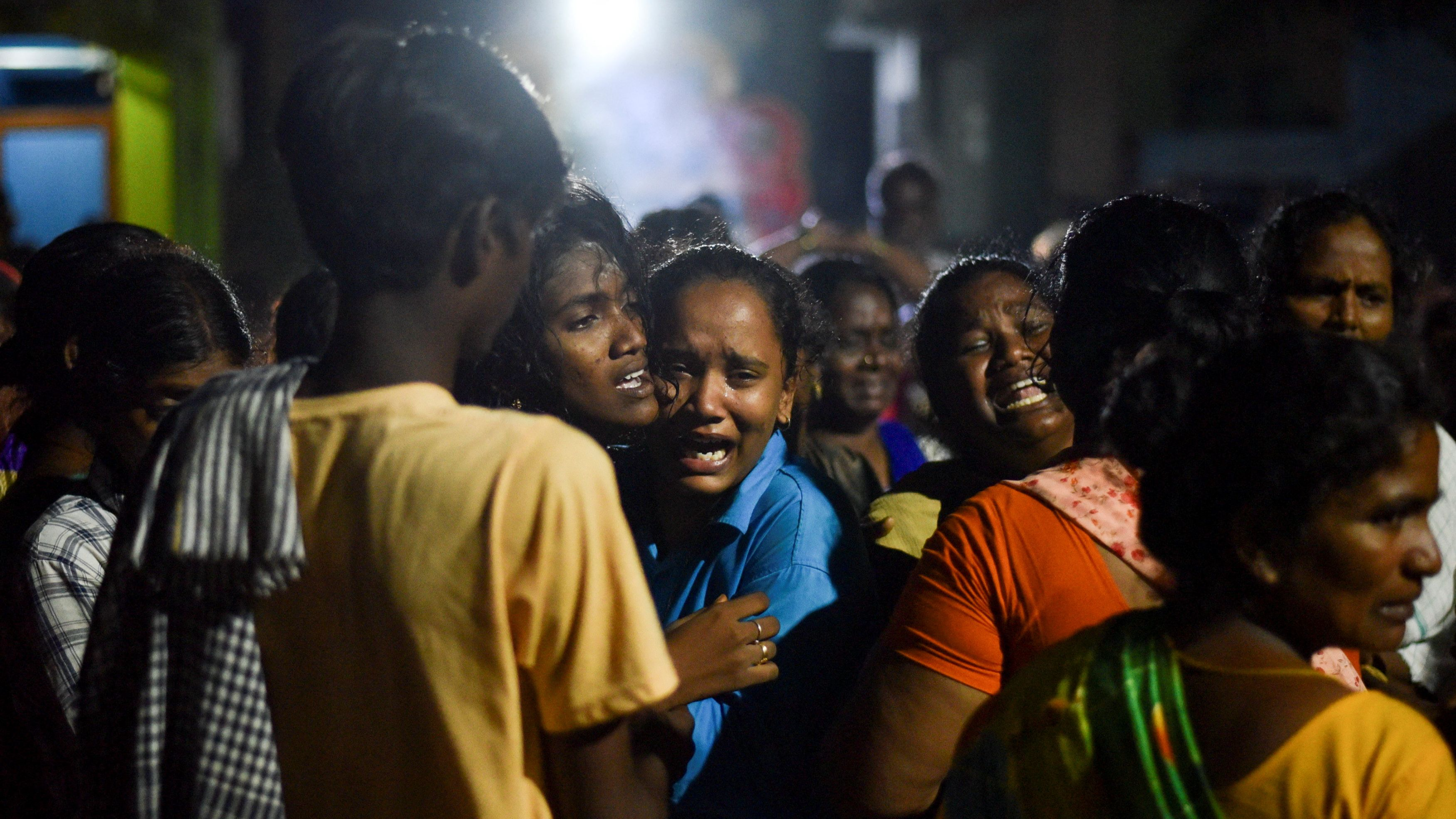 Family members mourn the deaths of those who died after consuming toxic liquor in Kallakurichi, Tamil Nadu, India, June 20, 2024. /Reuters