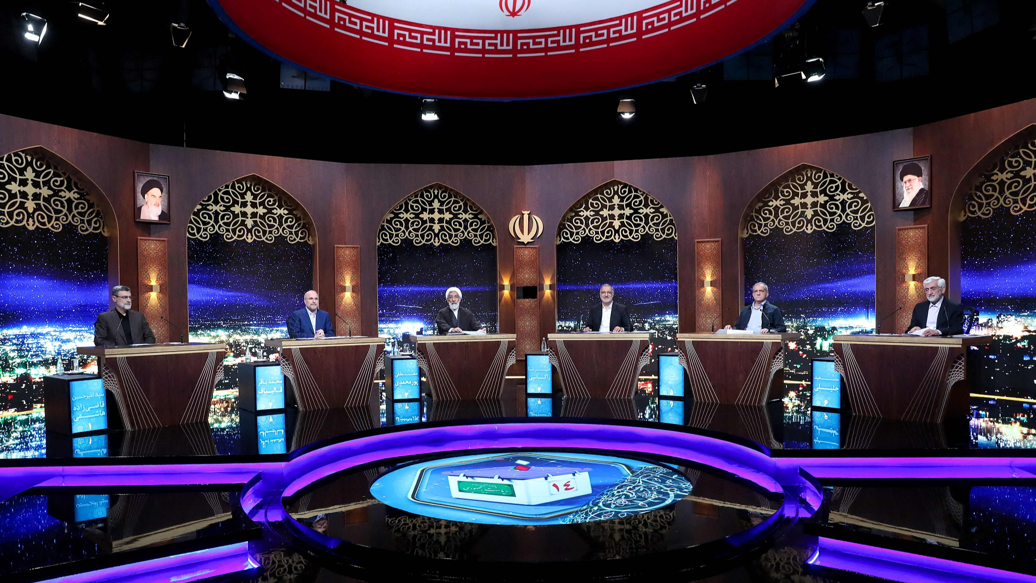 Six presidential candidates sit side by side at Iran's state television studio for a debate in Tehran, June 20, 2024. /CFP