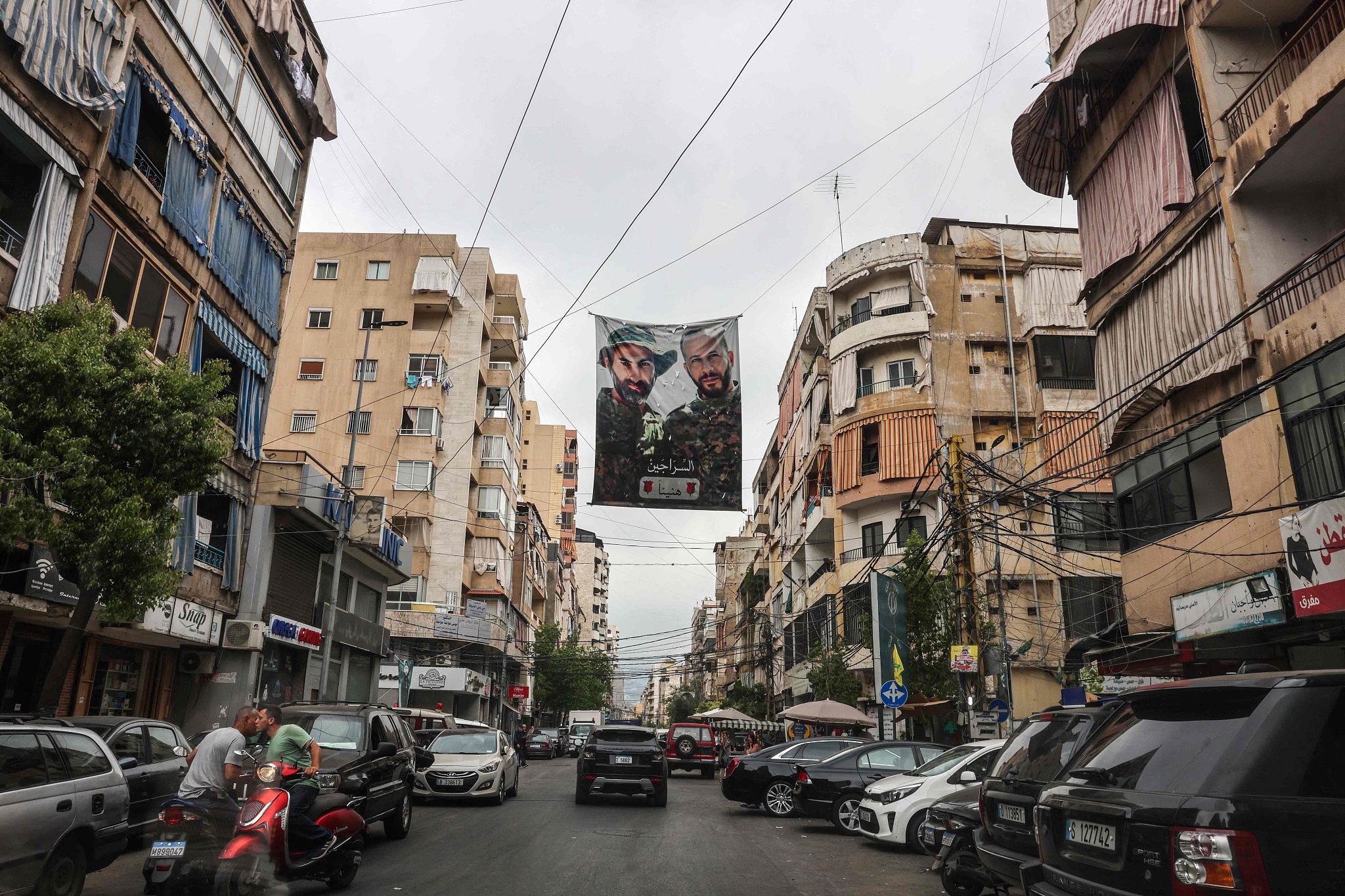 The faces of two Hezbollah fighters killed by Israeli attacks are printed on a poster in the southern suburb of Beirut on June 21, 2024. Fears of a regional war escalated on June 20 after Lebanon's powerful Hezbollah movement said none of Israel would be spared in a full-blown conflict, following Israel's announcement that it had approved plans for a Lebanon offensive. /CFP