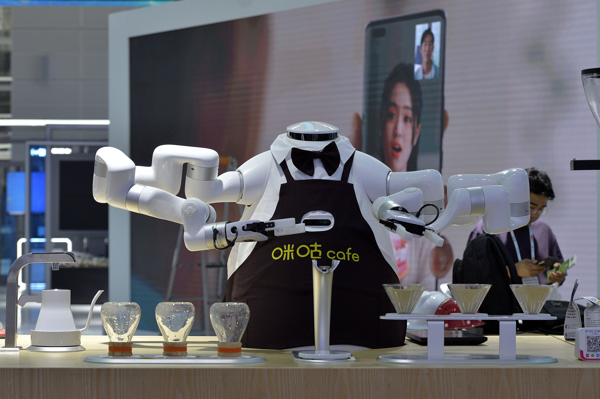 A robot barista on display at the World Intelligence Expo 2024 in north China's Tianjin Municipality, June 20, 2024. /CFP