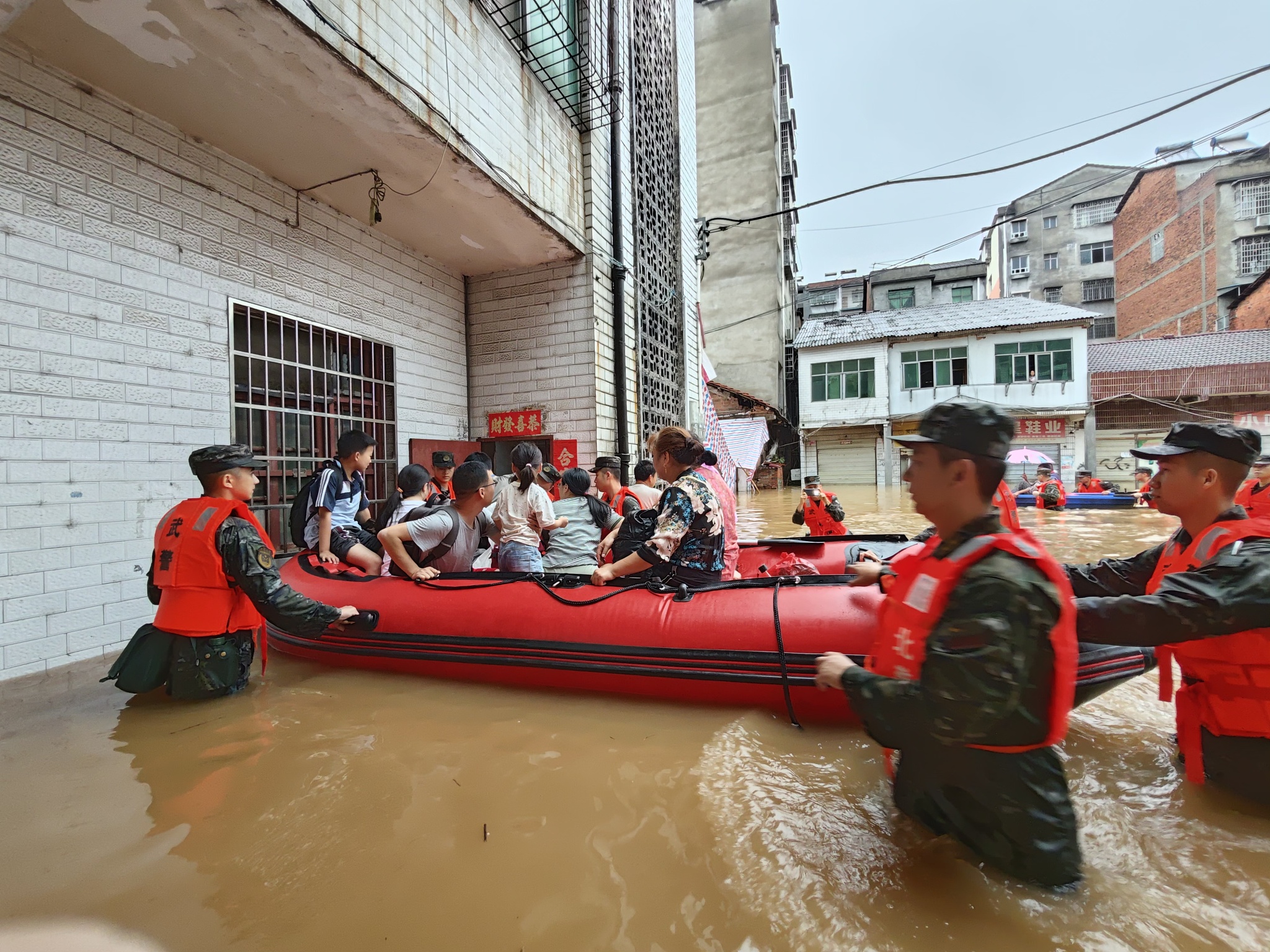 Rescuers evacuate people from flooding in Xianning City, central China's Hubei Province, June 22, 2024. /CFP