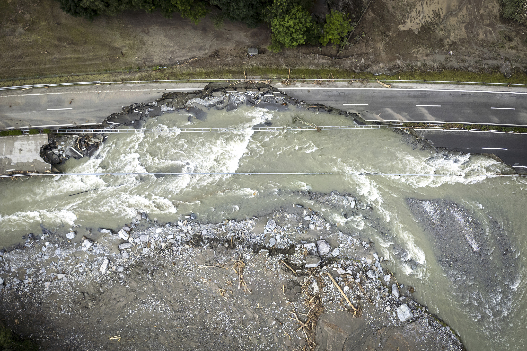 The highway A13 between Lostallo and Soazza is seen destroyed by the force of the Moesa River, caused by heavy rain in the Misox Valley, in Lostallo, southern Switzerland, on June 23, 2024. /CFP