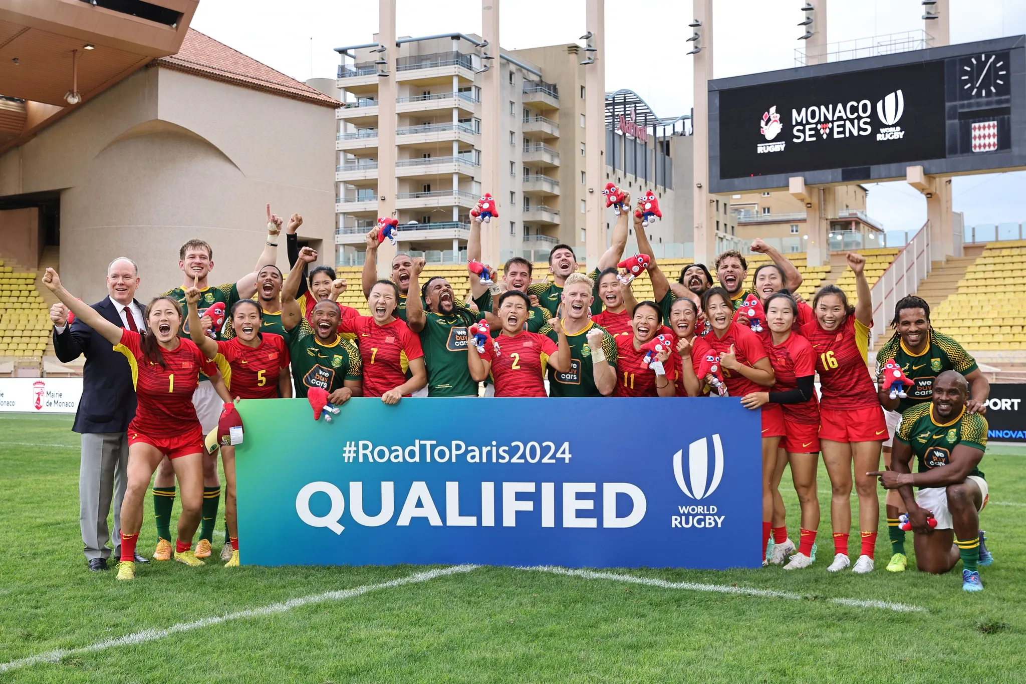 Players from China and South Africa celebrate after securing women's and men's qualification, respectively, in rugby sevens for the 2024 Summer Olympics at the World Rugby Sevens Repechage in Monaco, June 23, 2024. /World Rugby