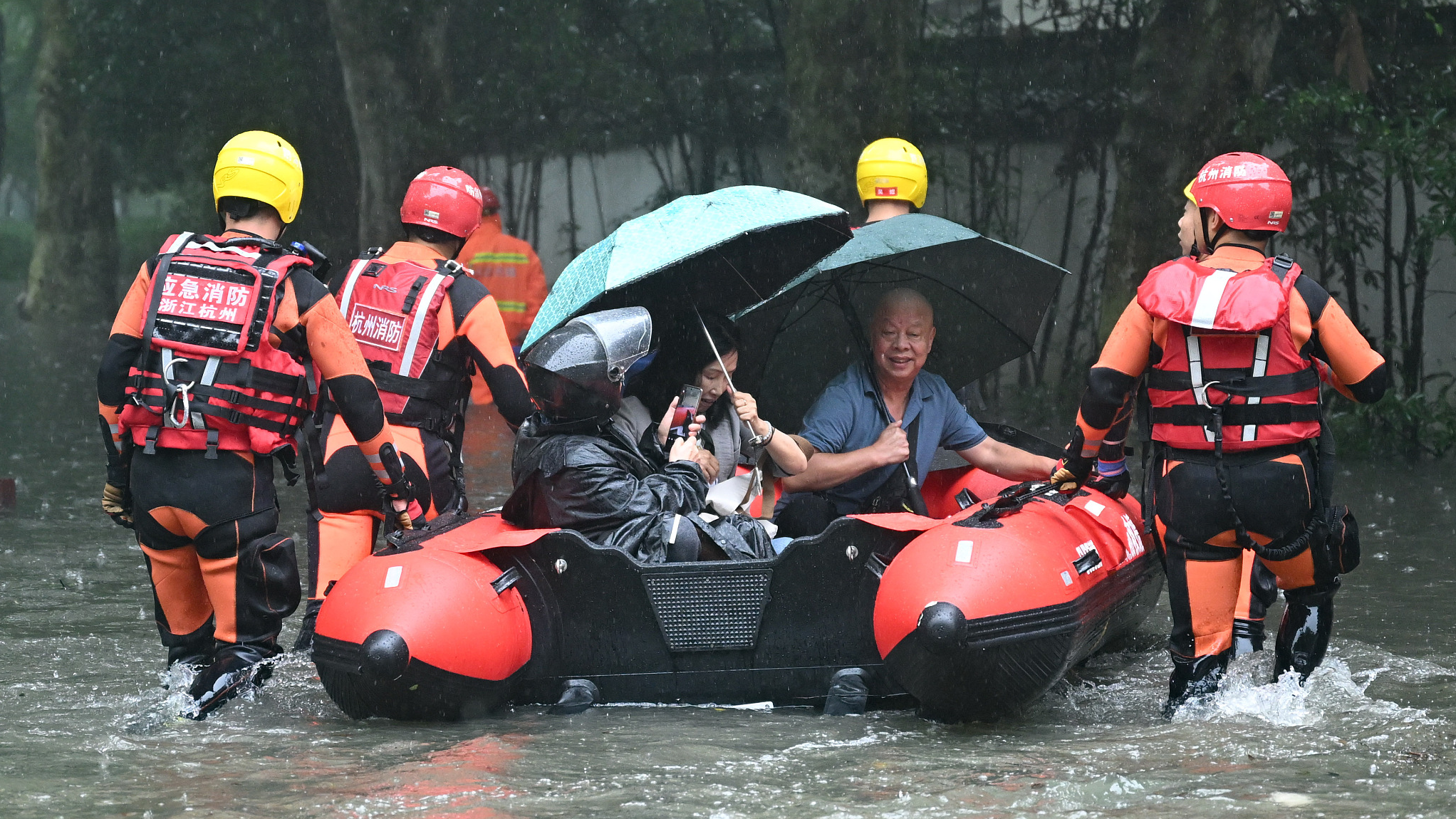 Firefighters rescue people trapped in the flood in Hangzhou, Zhejiang Province, June 26, 2024. /CFP