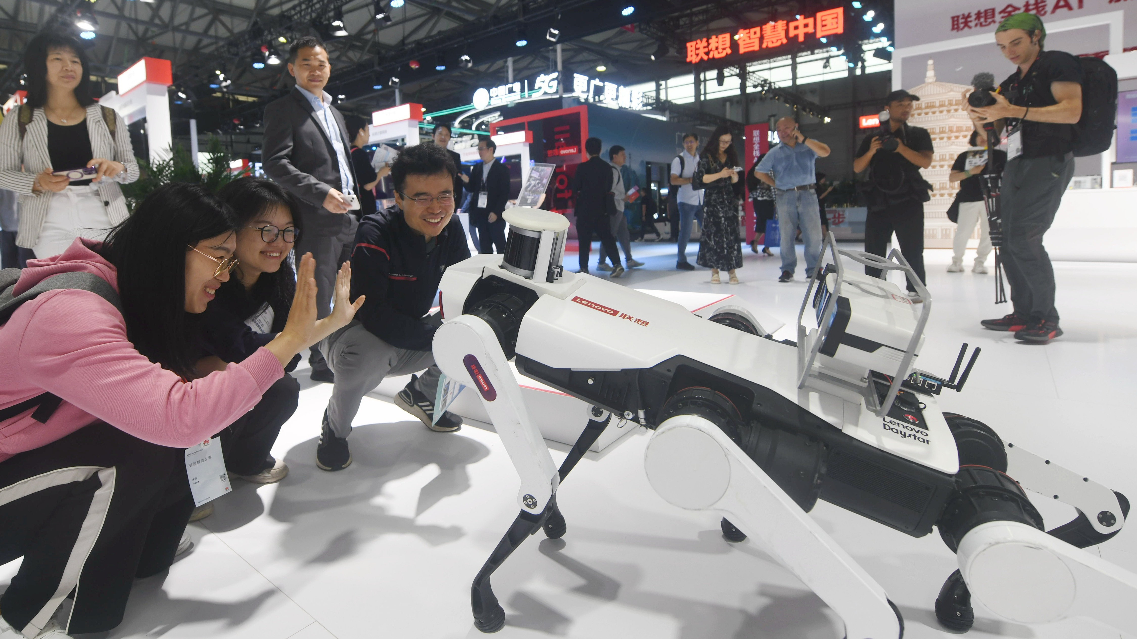 Visitors interact with an intelligent robot dog during the 2024 Mobile World Congress (MWC) Shanghai at the Shanghai New International Expo Center, Shanghai, China, June 26, 2024. /CFP