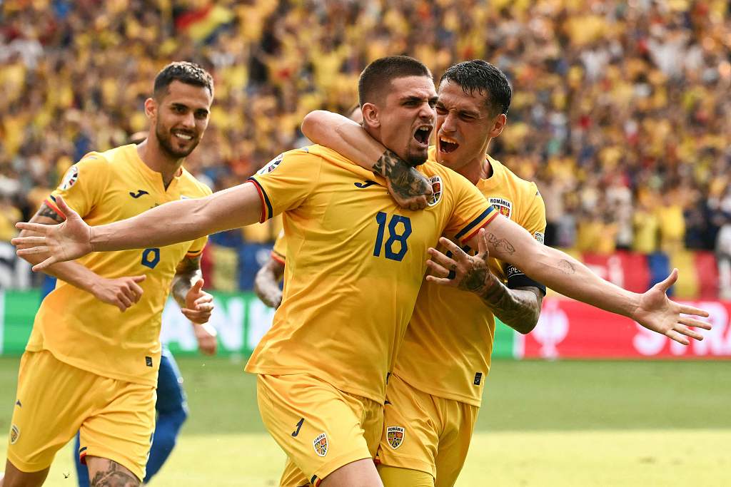 Razvan Marin (C) of Romania celebrates with teammates after scoring a goal from the penalty spot during a UEFA Euro 2024 Group E match between Slovakia and Romania, in Frankfurt, Germany, June 26, 2024. /CFP