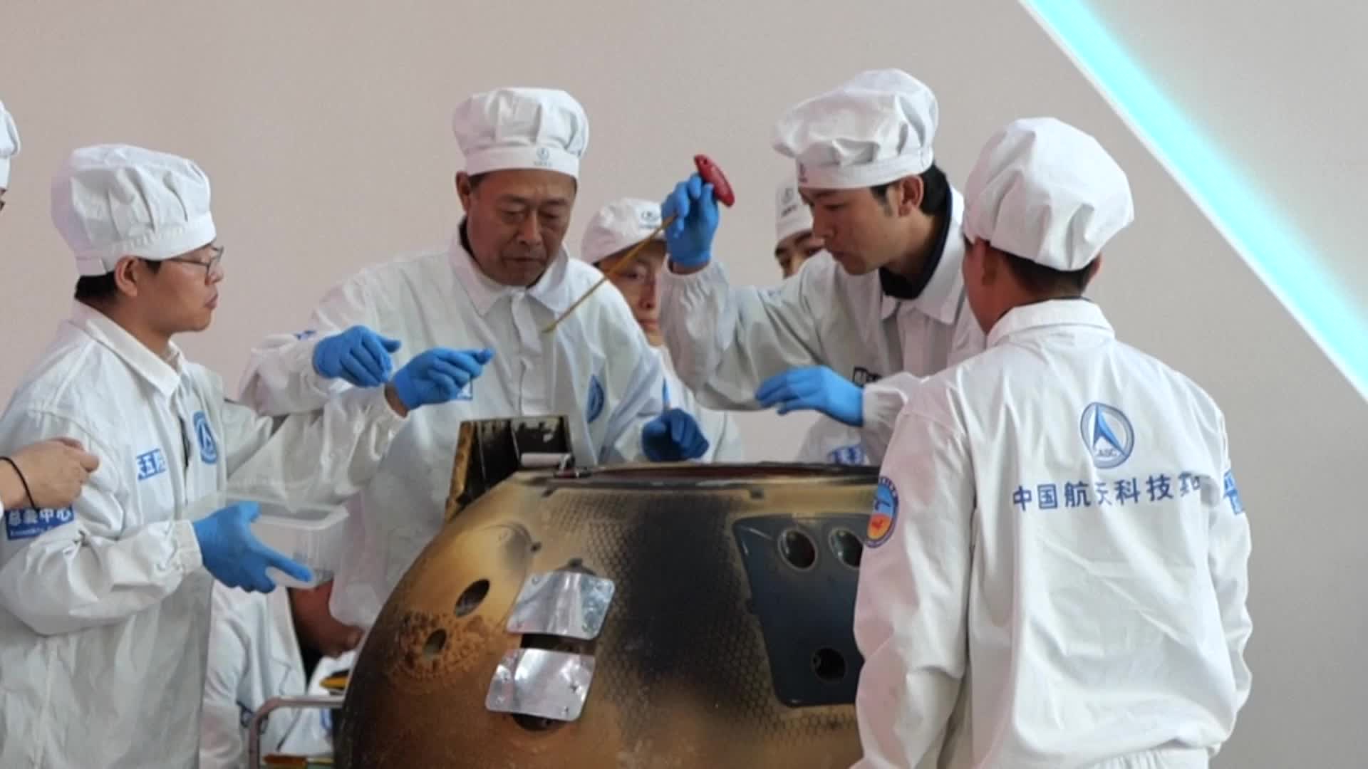 The returner of China's Chang'e-6 lunar probe was opened at a ceremony in Beijing on June 26, 2024. /IC