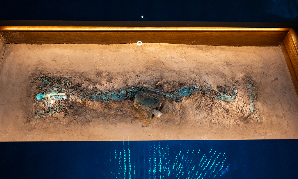An undated photo shows a dragon-shaped turquoise artifact on display at the Chinese Archaeological Museum in Beijing. /CFP