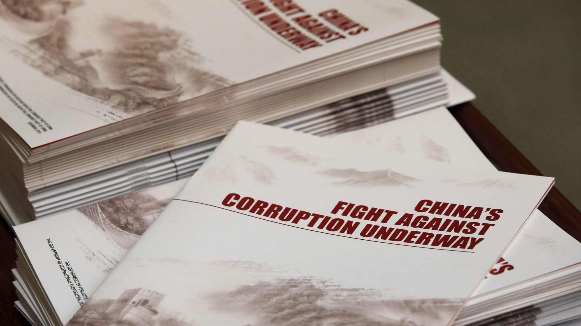 Copies of a booklet from the Central Commission for Discipline Inspection are seen on a table during a news conference in Beijing, China, January 15, 2016. /CFP
