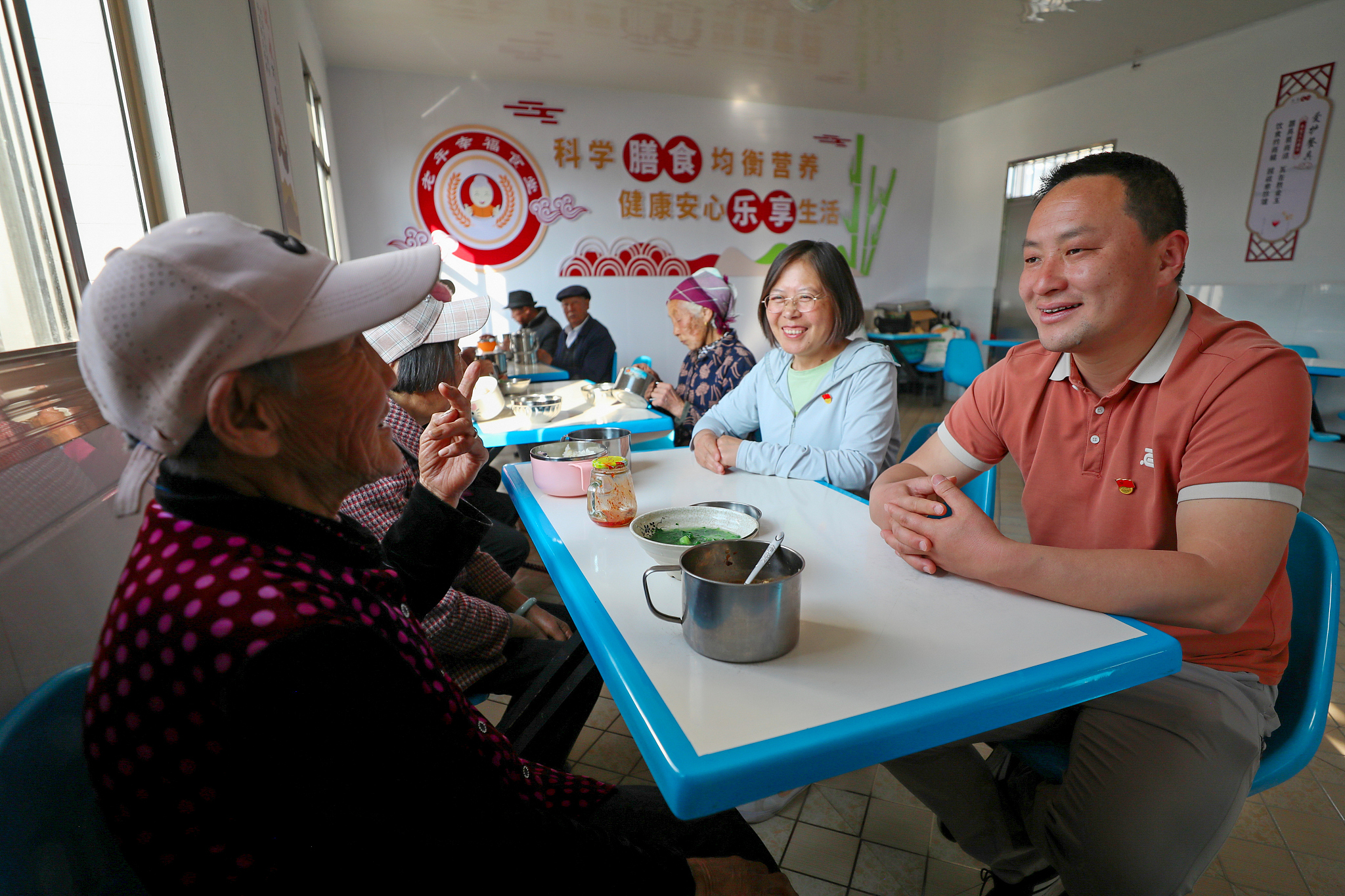 Officials visit a community home care service center and talk with the elderly residents to learn about the implementation of rural pension policies, Luliang County of Qujing, southwest China's Yunnan Province, March 26, 2024. /CFP