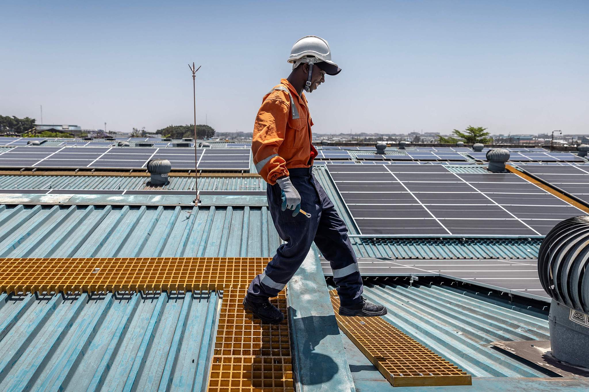 A technician works on the maintenance of solar panels at a partially solar-powered factory in Nairobi, Kenya, October 9, 2023. /CFP