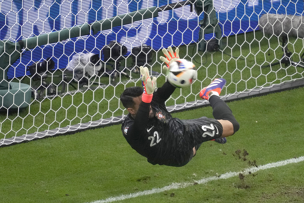 Goalkeeper Diogo Costa pf Portugal saves a penalty by Slovenia in the Euro 2024 Round of 16 game in Frankfurt, Germany, July 1, 2024. /CFP