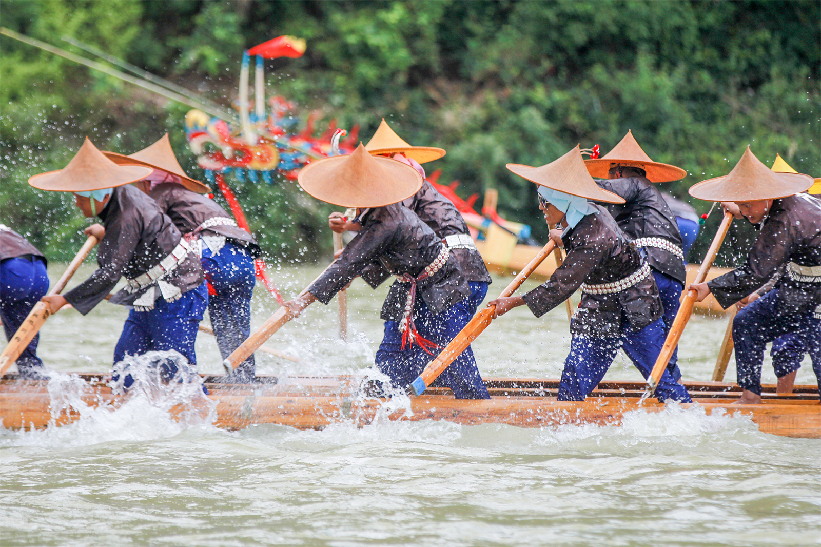 People of the Miao ethnic group compete in a canoe dragon boat race on the Qingshui River in Shibing County, Guizhou Province. /CFP