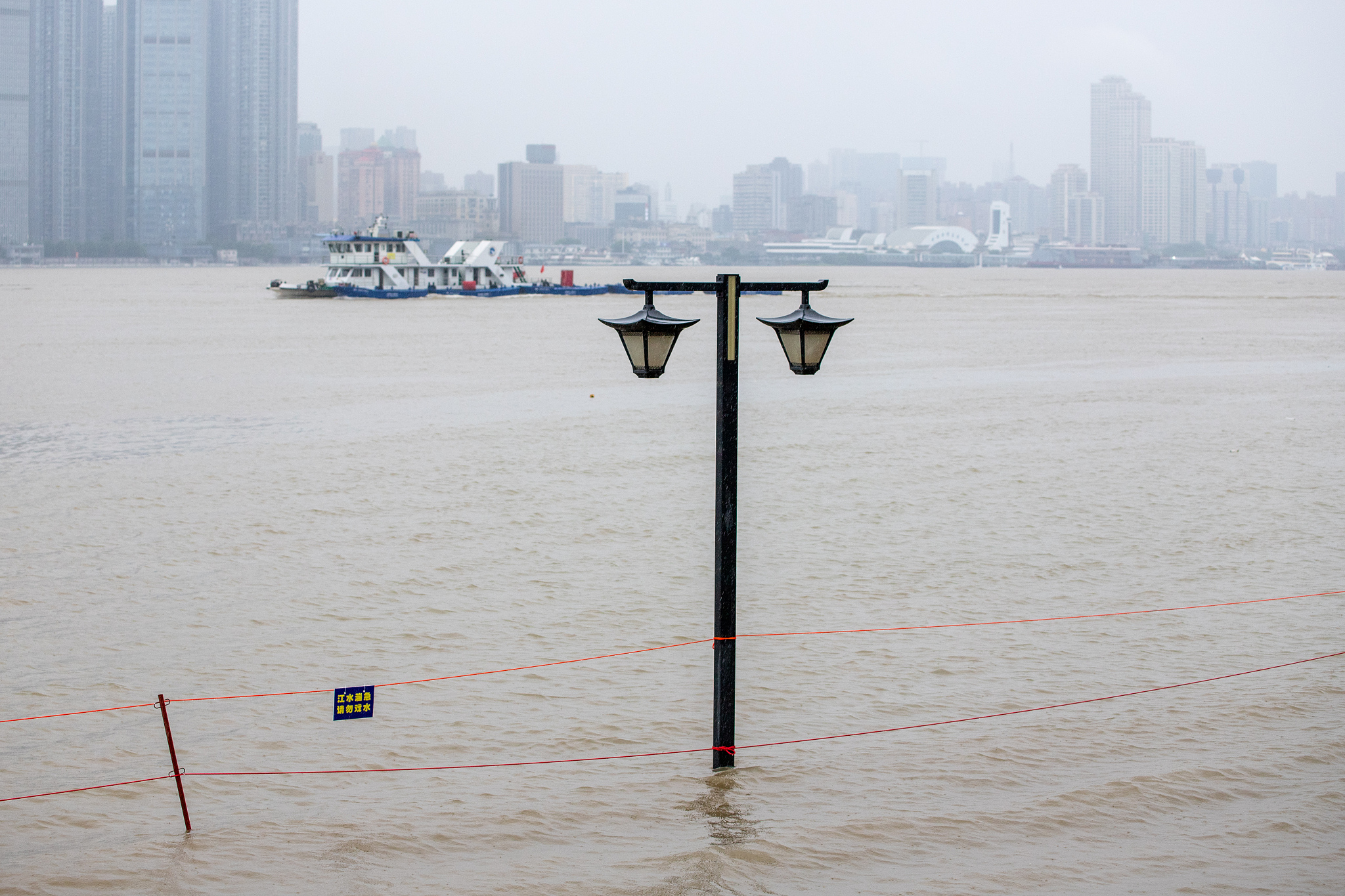 Wuhan City of central China's Hubei Province experienced continuous rainy weather, and the water level of the Yangtze River kept rising on July 1, 2024. /CFP