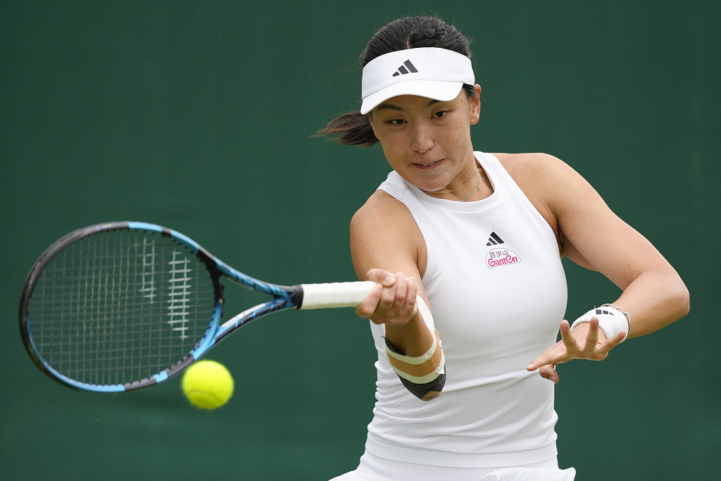 Wang Xinyu of China competes in a women's singles first round match against Viktoriya Tomova of Bulgaria at the Wimbledon Championships at the All England Lawn Tennis and Croquet Club in London, UK, July 2, 2024. /CFP