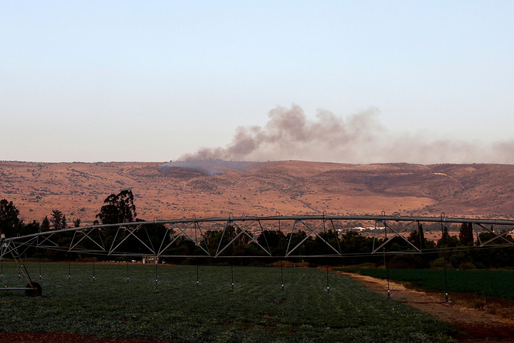 Smoke billows over hills in the Israeli-annexed Golan Heights after rockets were fired from southern Lebanon on July 3, 2024. /CFP
