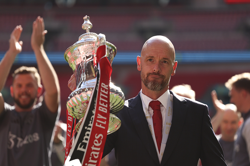 Erik ten Hag, manager of Manchester United, celebrates with the FA Cup trophy after defeating Manchester City in the final at Wembley Stadium in London, England, May 25, 2024. /CFP