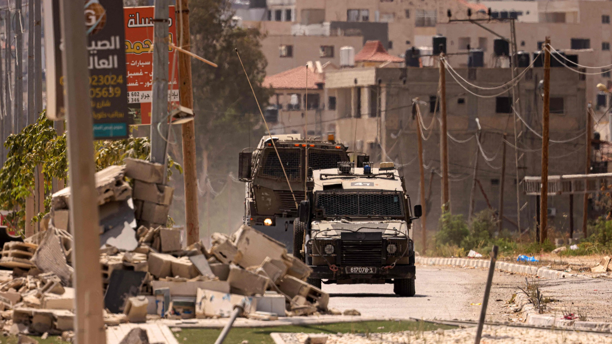Israeli military vehicles drive along a street during a raid in the occupied West Bank city of Jenin, July 5, 2024. /CFP