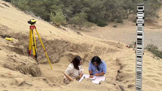 A team of archaeologists work on what appear to be parts of a 4,000-year-old ceremonial temple buried in a sand dune of northern Peru, in Lambayeque, Peru, June 27, 2024. /Reuters