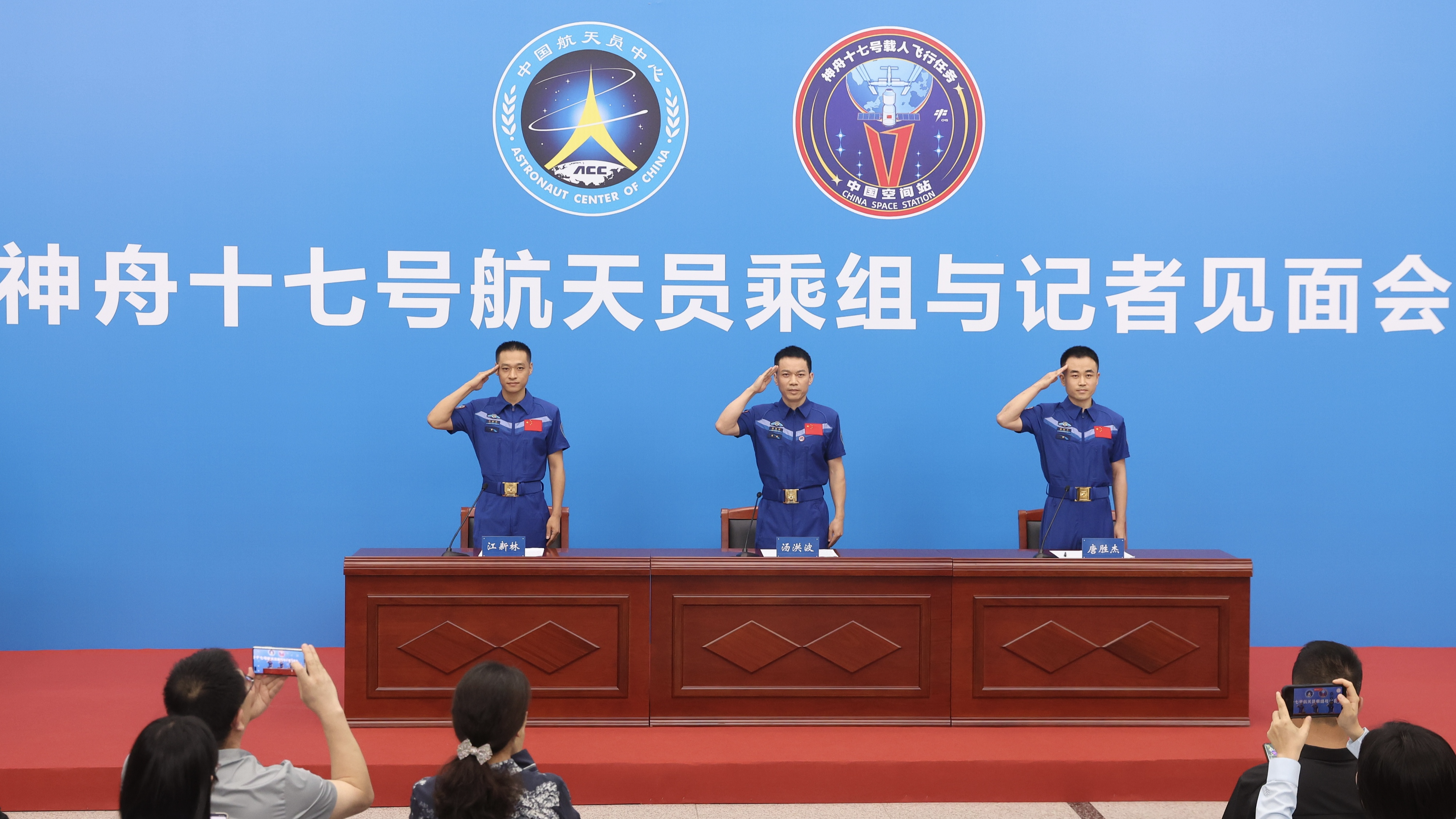 The three astronauts from China's Shenzhou-17 crewed mission meet the press in Beijing, July 5, 2024. /CFP