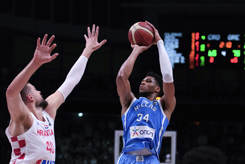 Giannis Antetokounmpo (R) of Greece shoots in one of the 2024 FIBA Men's Olympic Qualifying Tournaments finals against Croatia in Piraeus, Greece, July 7, 2024. /CFP