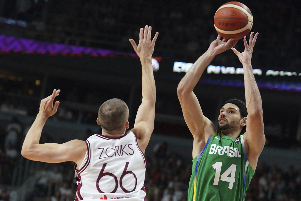 Leo Meindl (#14) of Brazil shoots in one of the 2024 FIBA Men's Olympic Qualifying Tournaments finals against Latvia in Riga, Latvia, July 7, 2024. /CFP