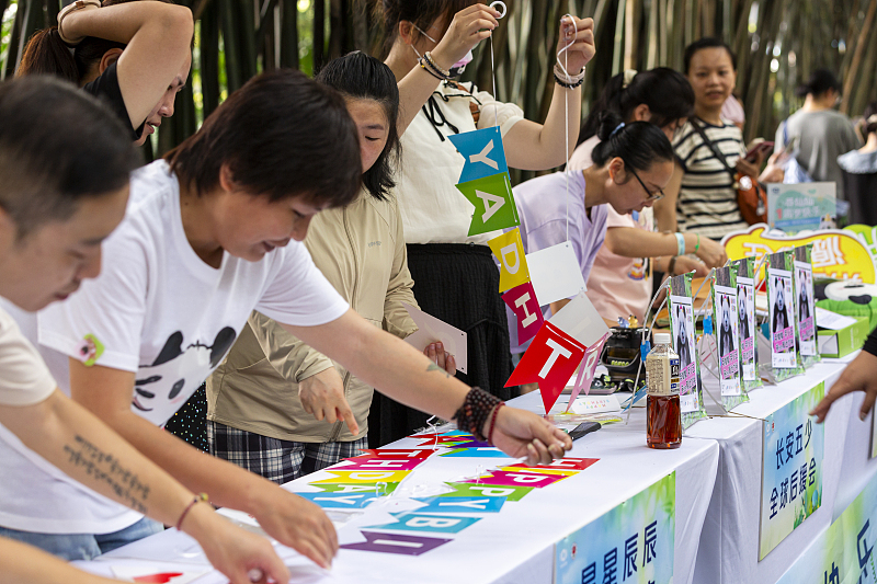 Visitors participate in activities to celebrate giant panda Mang Cancan's first birthday at Chongqing Zoo in southwest China, July 6, 2024. /CFP