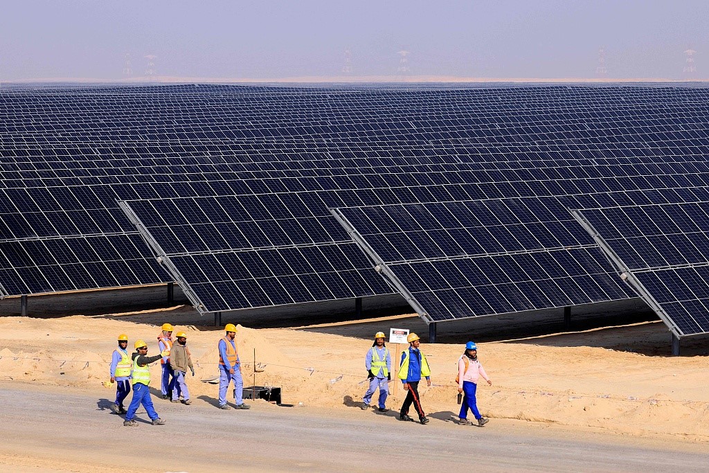 Employees walk at Al Dhafra Solar Photovoltaic (PV) Independent Power Producer (IPP) project, in the United Arab Emirates' capital Abu Dhabi, January 31, 2023. /CFP