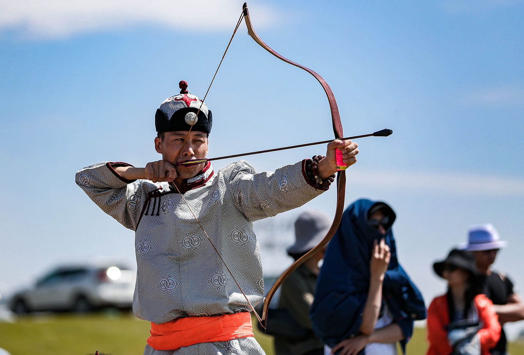 A file photo shows a man taking part in an archery tournament during the Naadam Festival in Inner Mongolia. /CFP