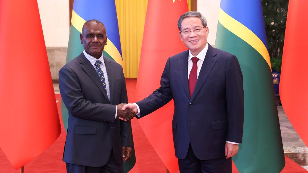 Chinese Premier Li Qiang shakes hands with Solomon Islands Prime Minister Jeremiah Manele in Beijing, China, July 11, 2024. /CMG