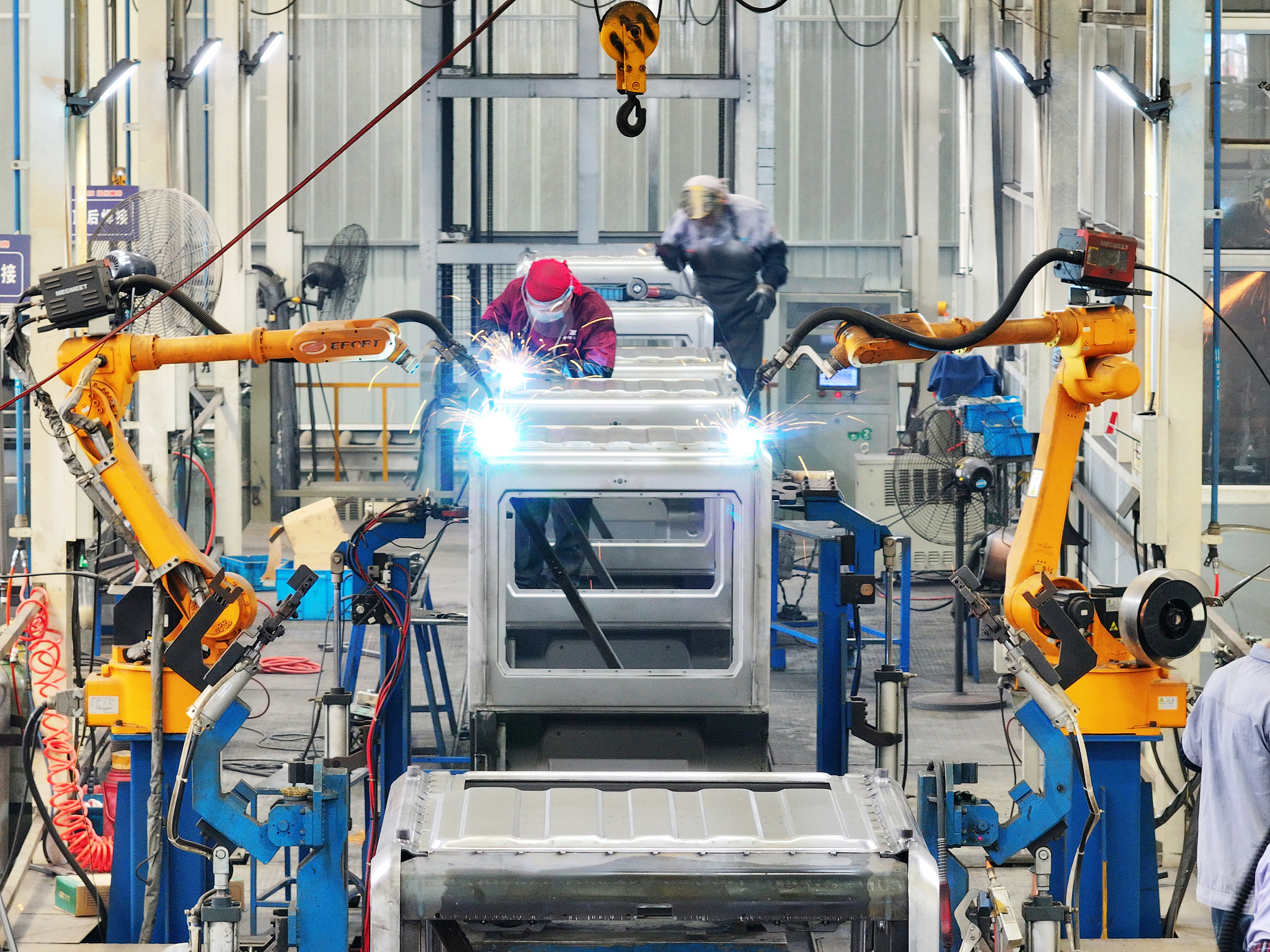 Robotic arms doing welding work along an intelligent production line in Yangzhou, Jiangsu Province, China, July 4, 2024. /CFP