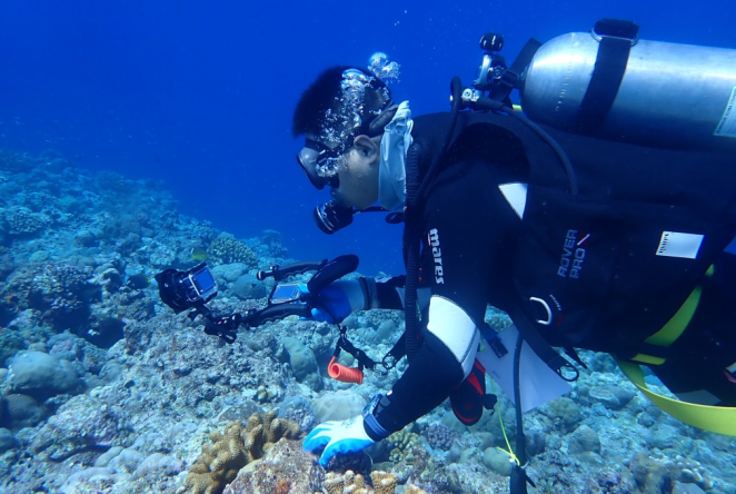 A researcher conducts underwater surveys on coral reefs near Huangyan Dao. /Ministry of Ecology and Environment