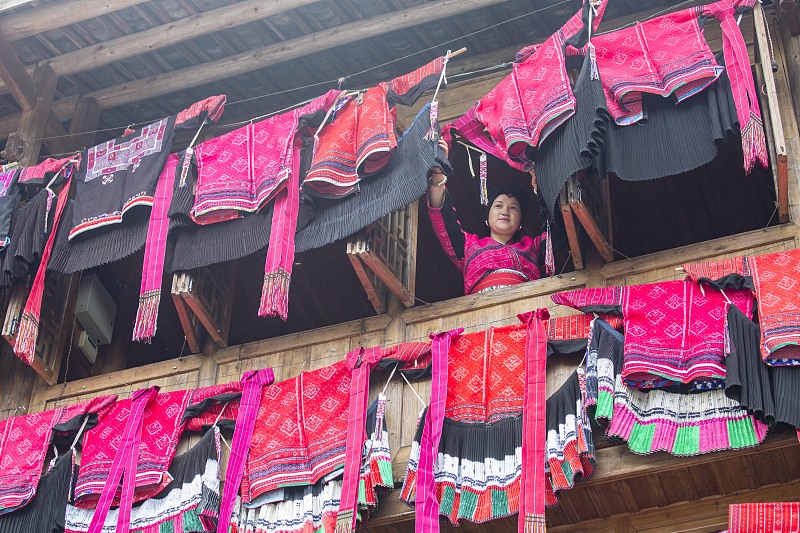 Yao people dry their clothes from their windows to celebrate the Drying Clothes Festival in Guilin, Guangxi. /CFP