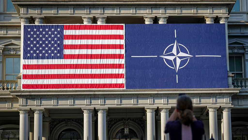 U.S. and NATO flags are seen on the Eisenhower Building as the NATO summit begins with the celebrations to mark the 75th anniversary of the defense alliance, Washington, the U.S., July 9, 2024. /CFP