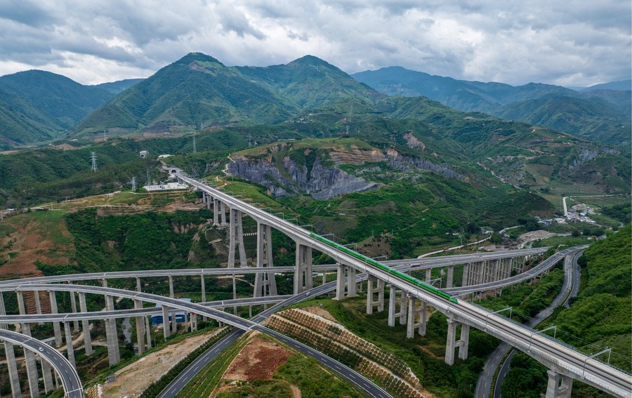 A Fuxing bullet train runs through the Nanxihe Grand Bridge on the China-Laos Railway in southwest China's Yunnan Province, June 2, 2022. /Xinhua