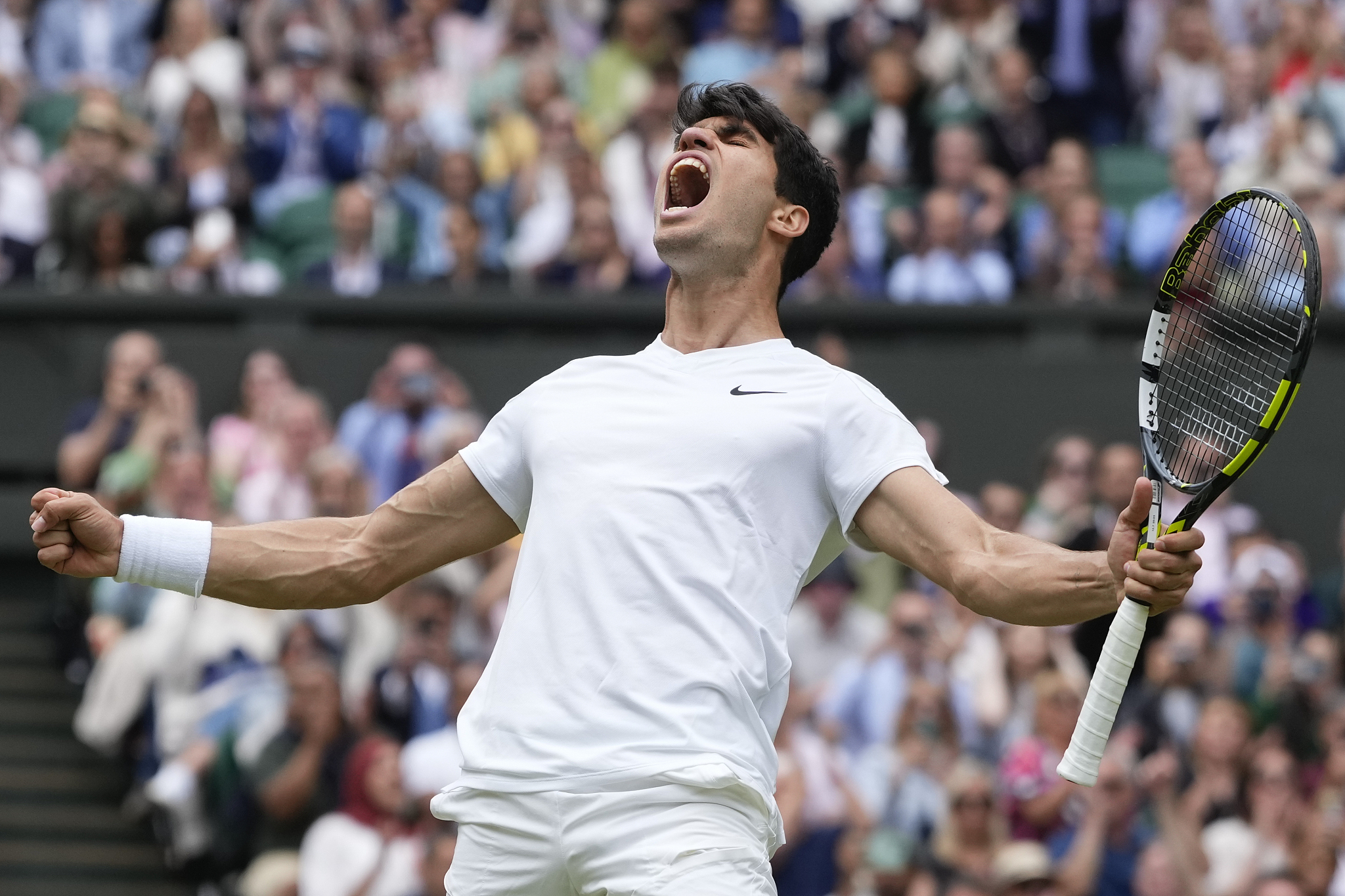 Carlos Alcaraz of Spain celebrates after defeating Daniil Medvedev of Russia in the men's semifinals match at the  Wimbledon Championships at the All England Lawn Tennis and Croquet Club in London, United Kingdom, July 12, 2024. /CFP