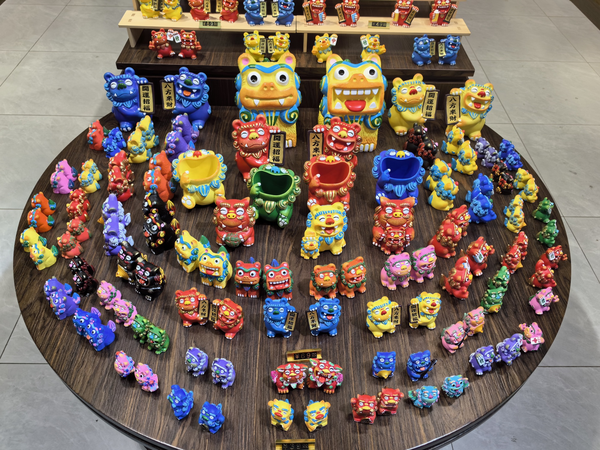 Lion shaped souvenirs are displayed in a shop in Ciqikou ancient town, Chongqing, on July 10, 2024. /CGTN