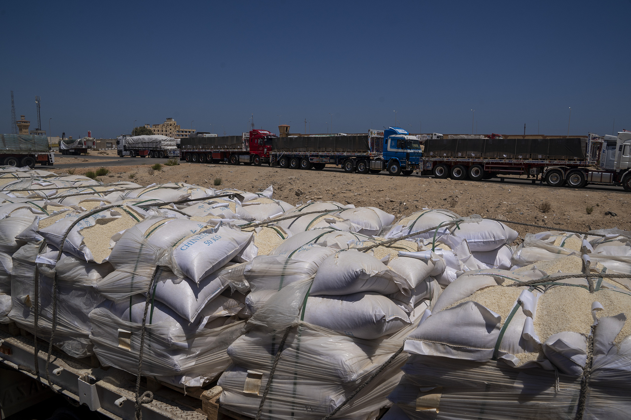 Aid trucks loaded with supplies For Gaza and some damaged supplies are queued in Al-Arish City as the border remains closed after being seized by Israel, Arish, Egypt, July 9, 2024. /CFP