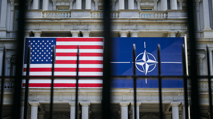 The flags of the U.S. and NATO hang on a building on the sidelines of the NATO summit in Washington, D.C., U.S., July 9, 2024. /CFP
