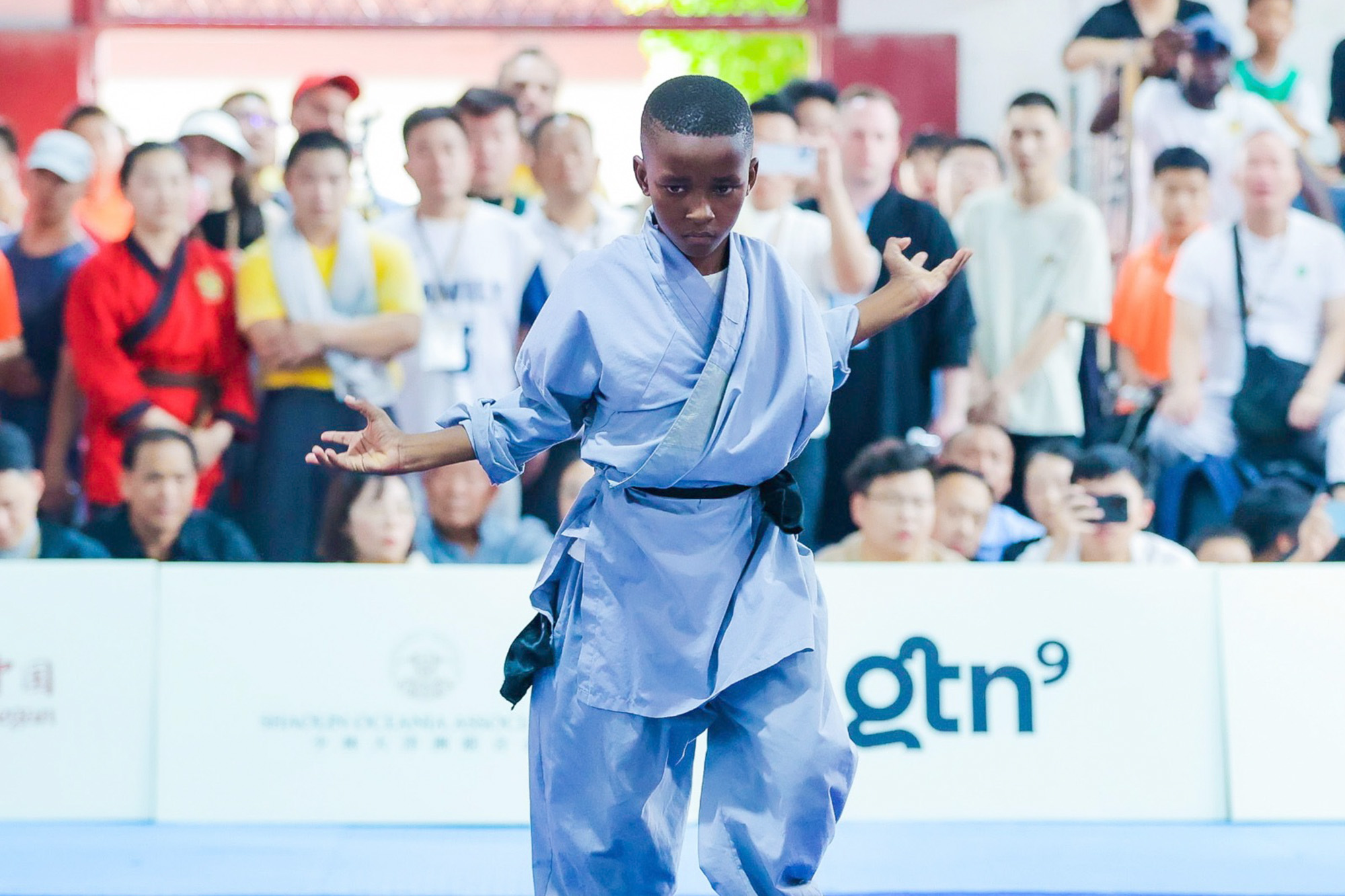 Kung fu athlete performs at the stage of the 2024 World Shaolin Games Finals, July 13, 2024. /CGTN
