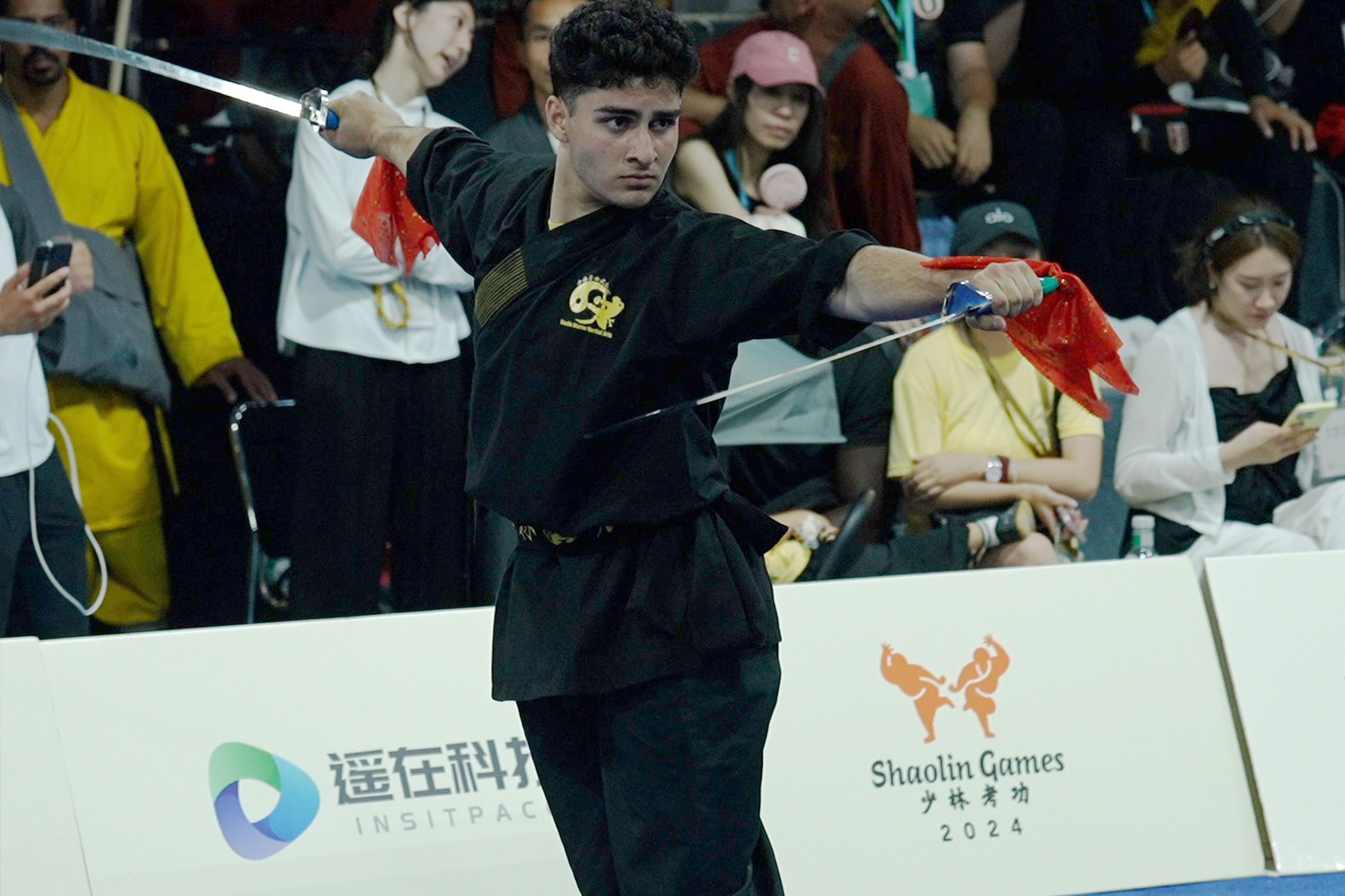 American kung fu athlete performs at the stage of the 2024 World Shaolin Games Finals, July 13, 2024. /CGTN