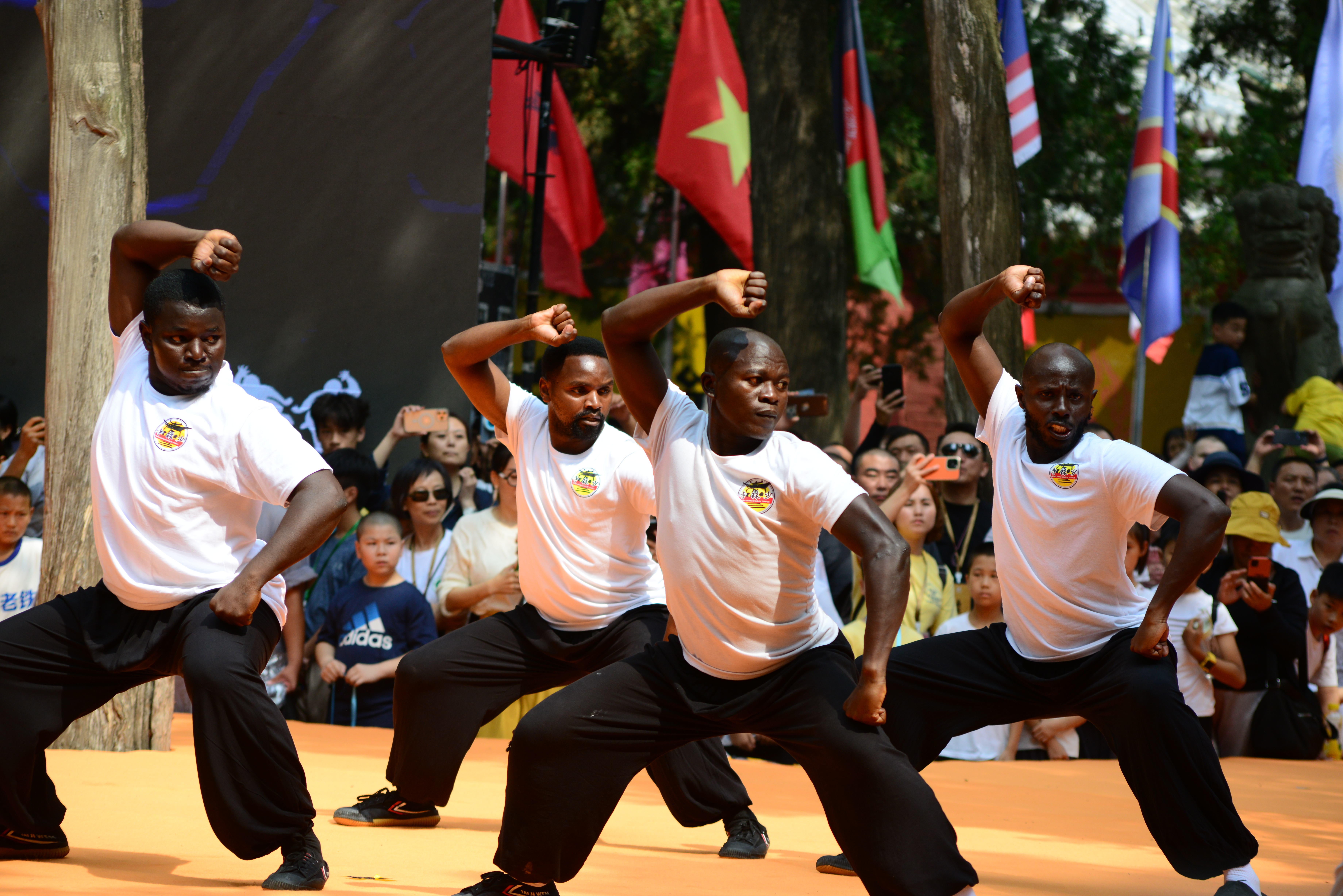 Overseas Shaolin disciples perform at the opening ceremony of the 2024 Shaolin Games Finals, July 13, 2024. /CGTN