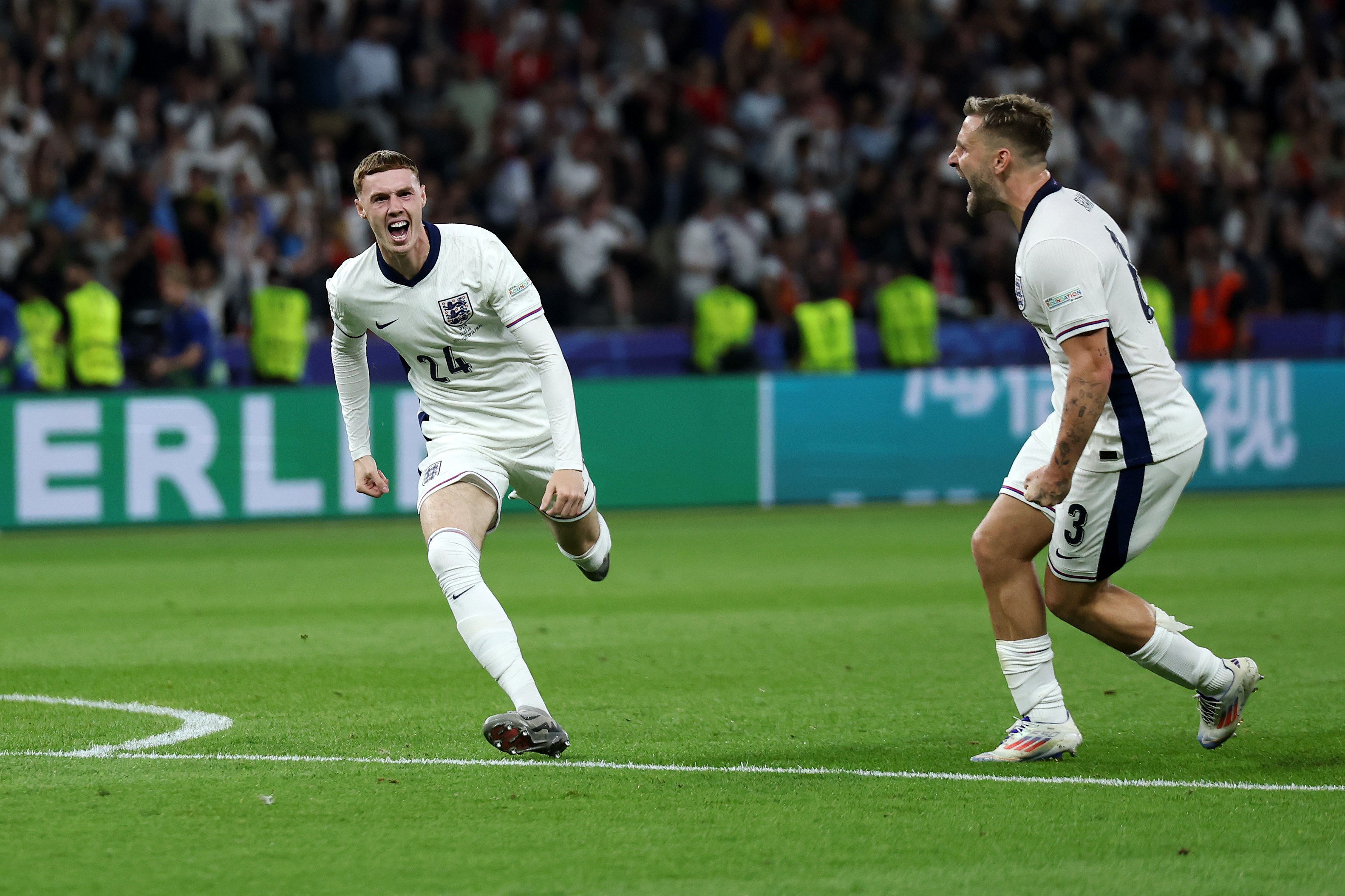 Cole Palmer of England (L) celebrates with teammate Luke Shaw after scoring their team's lone goal during the UEFA Euro 2024 final against Spain in Berlin, Germany, July 14, 2024. /CFP