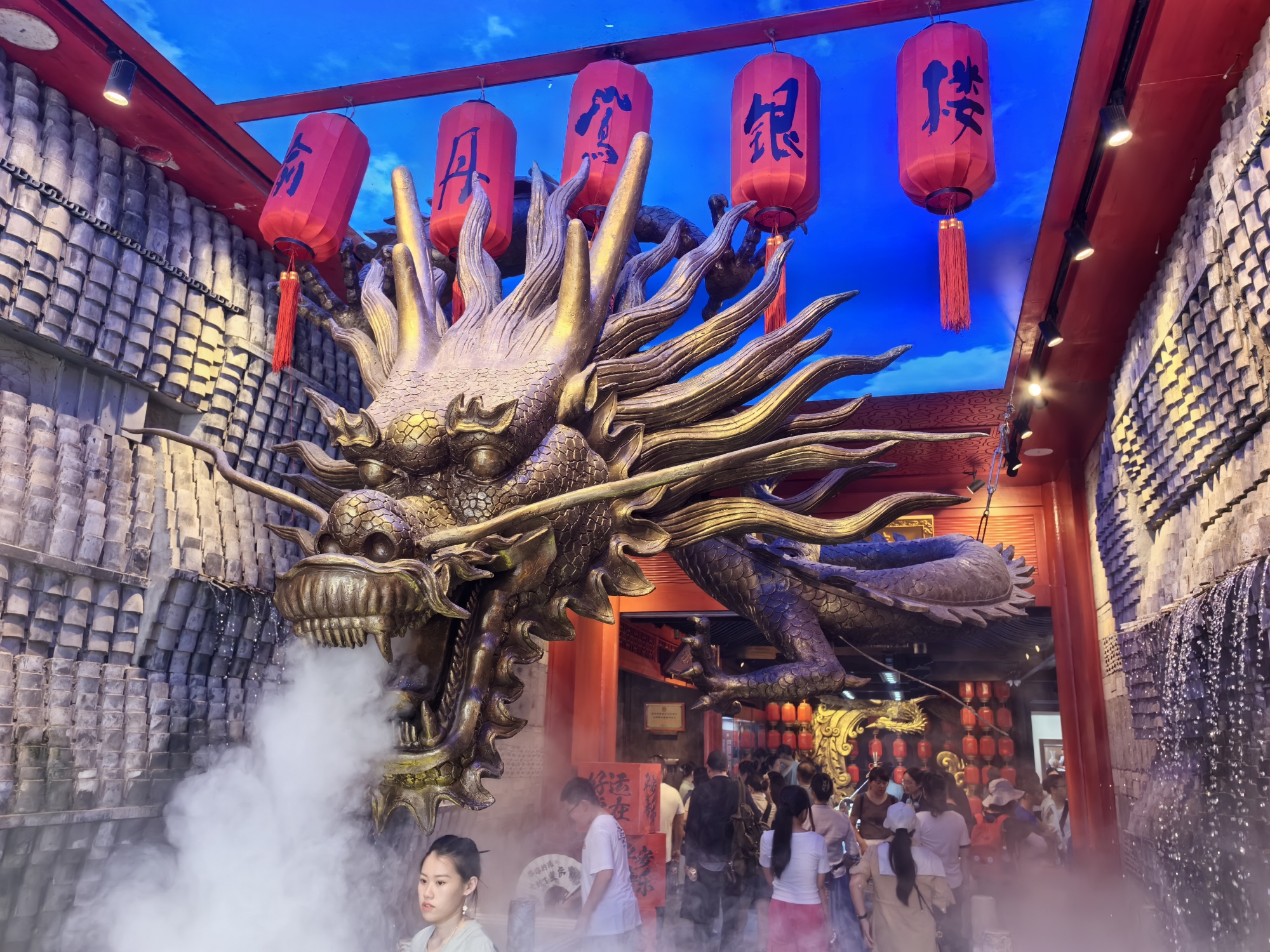 A Chinese dragon sculpture is displayed at a silverware store of the Eighteen Stairs district of Chongqing on July 11, 2024. /CGTN