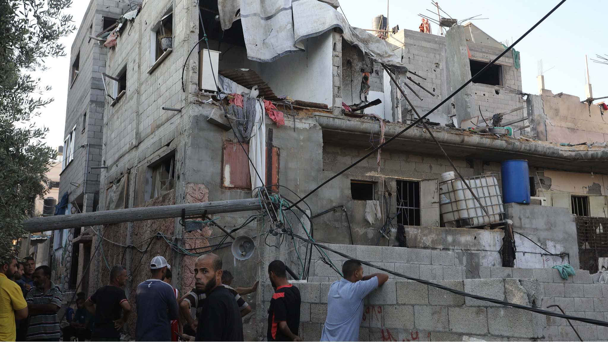 Palestinians inspect the area after an Israeli army attack hit the Abu Diab's house in the Nuseirat refugee camp in Deir al-Balah, Gaza, July 17, 2024. /CFP