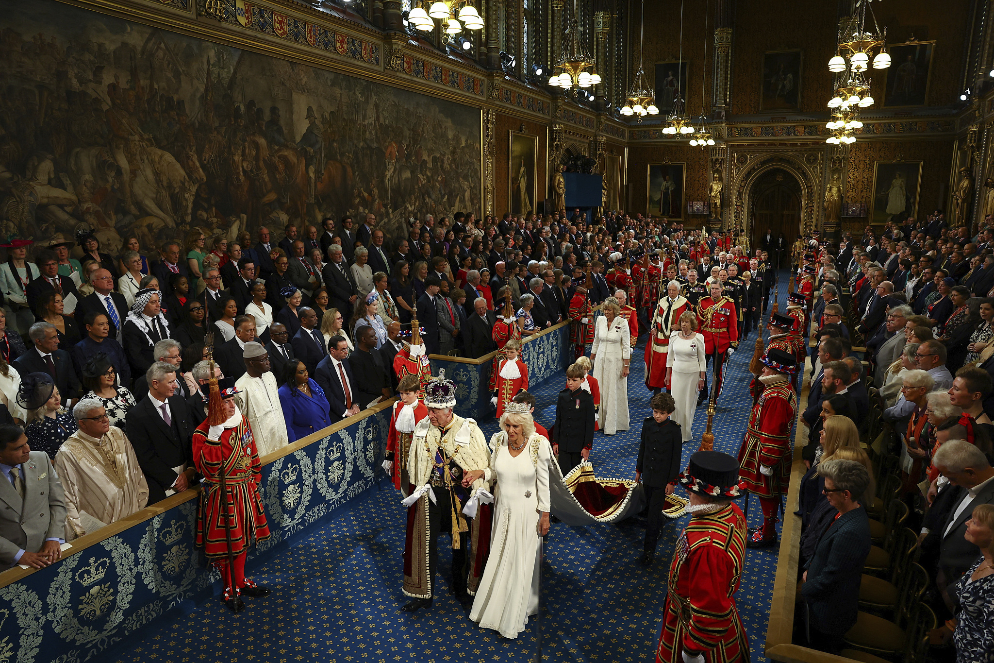 Britain's King Charles and Queen Camilla walk through the Royal Gallery during a ceremony on the day of the State Opening of Parliament at the Palace of Westminster in London, United Kingdom, July 17, 2024. /CFP