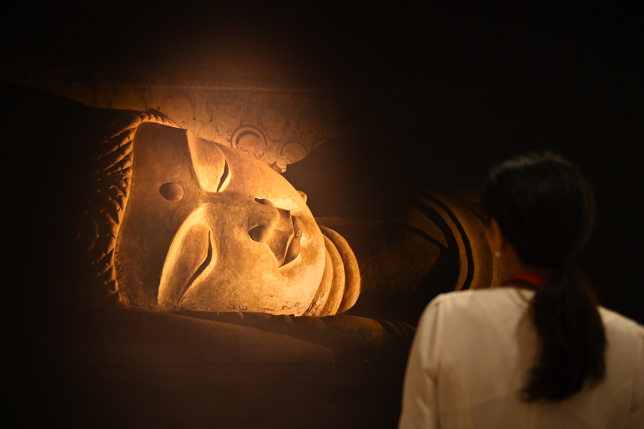 A photo taken on September 6, 2023 in Dunhuang, Gansu Province, showcases an exhibition featuring cave restoration models and colored sculpture production. /CFP