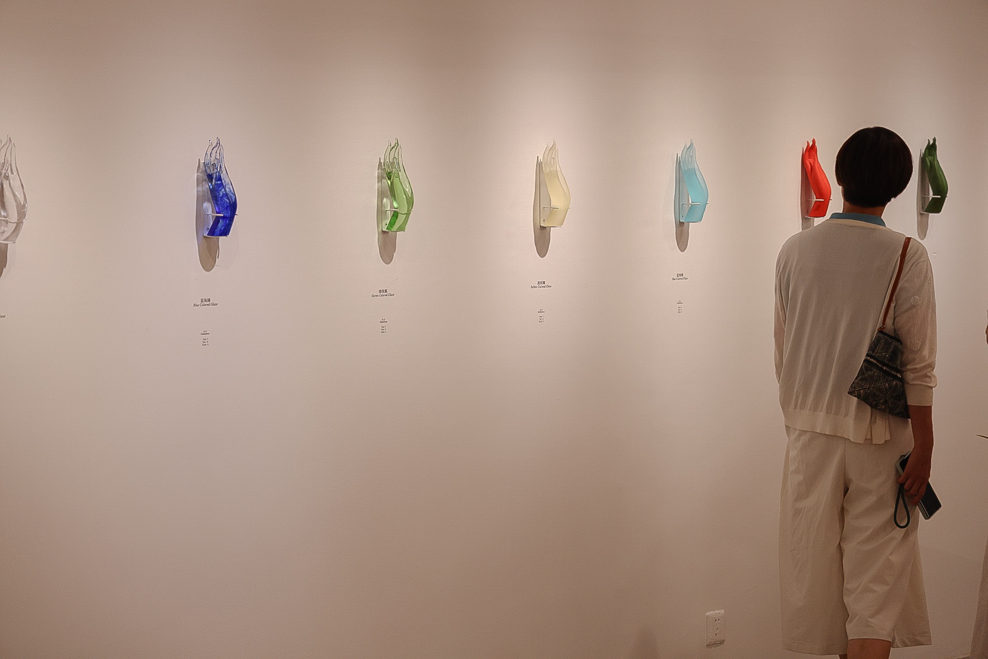 A visitor appreciates the artworks created by Chinese artist Jiang Sheng on display at the Topred Center for Contemporary Art in Xiamen, Fujian Province. /TCCA