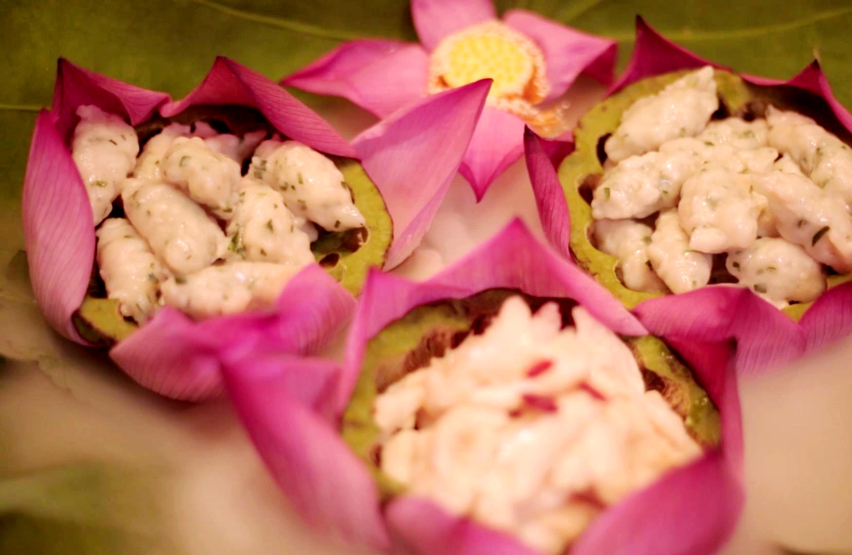 A photo shows a dish made from lotus flowers and seeds. /Photo provided to CGTN